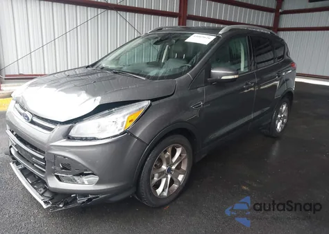 2014 Ford Escape Titanium z USA, uszkodzony, nr VIN 1FMCU0J91EUE57538